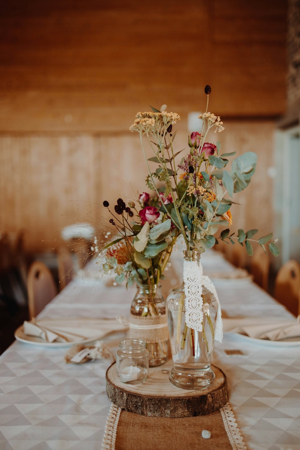 Long reception table with dried florals in glass