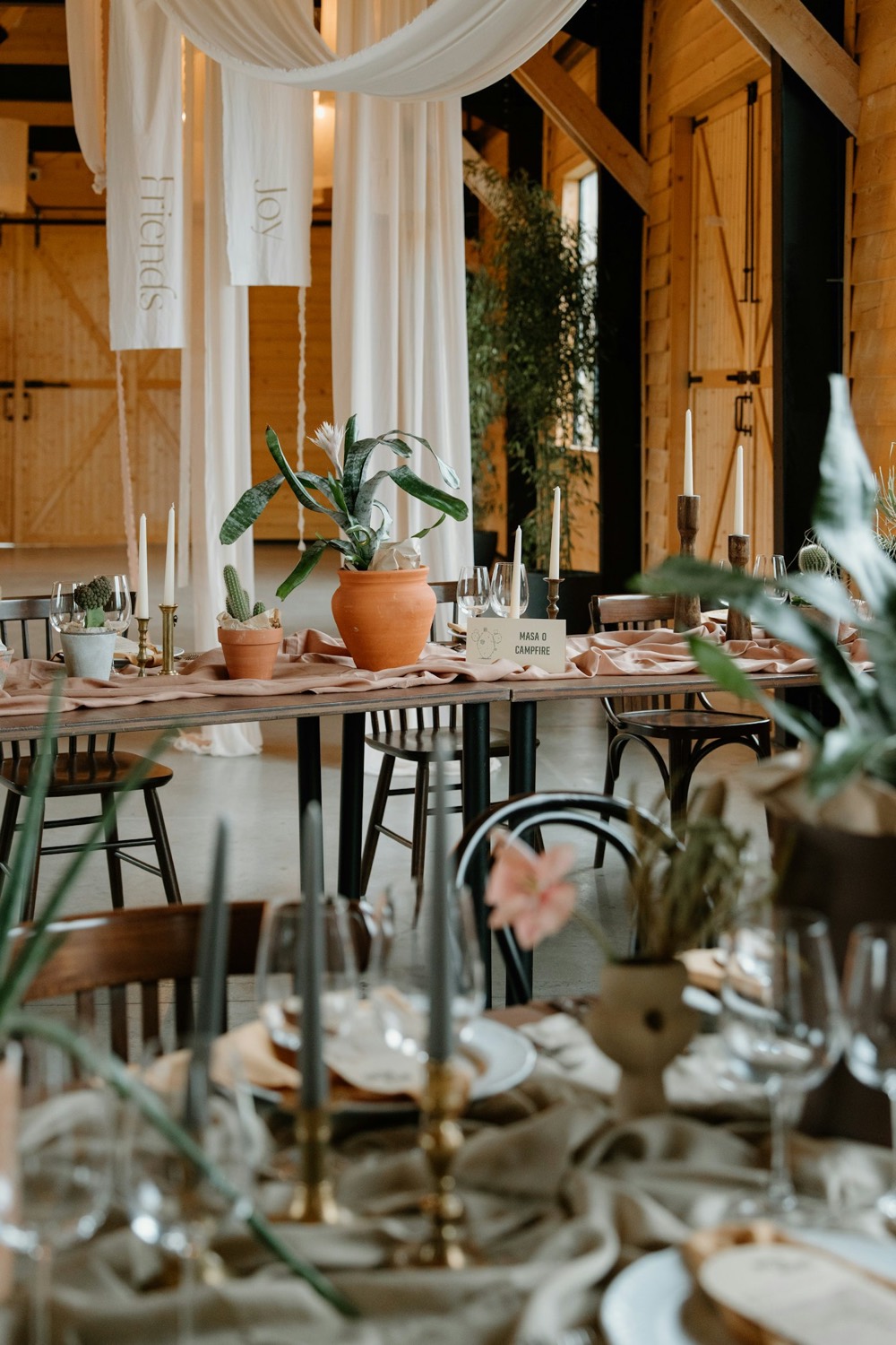 Reception tables set in a greenhouse