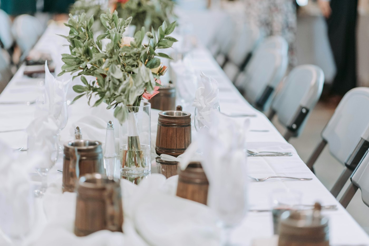 Rustic table with wooden containers and florals